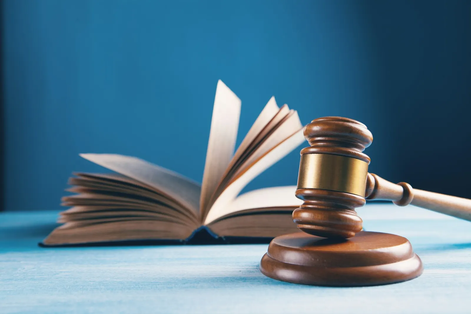 A judge's gavel resting on an open law book