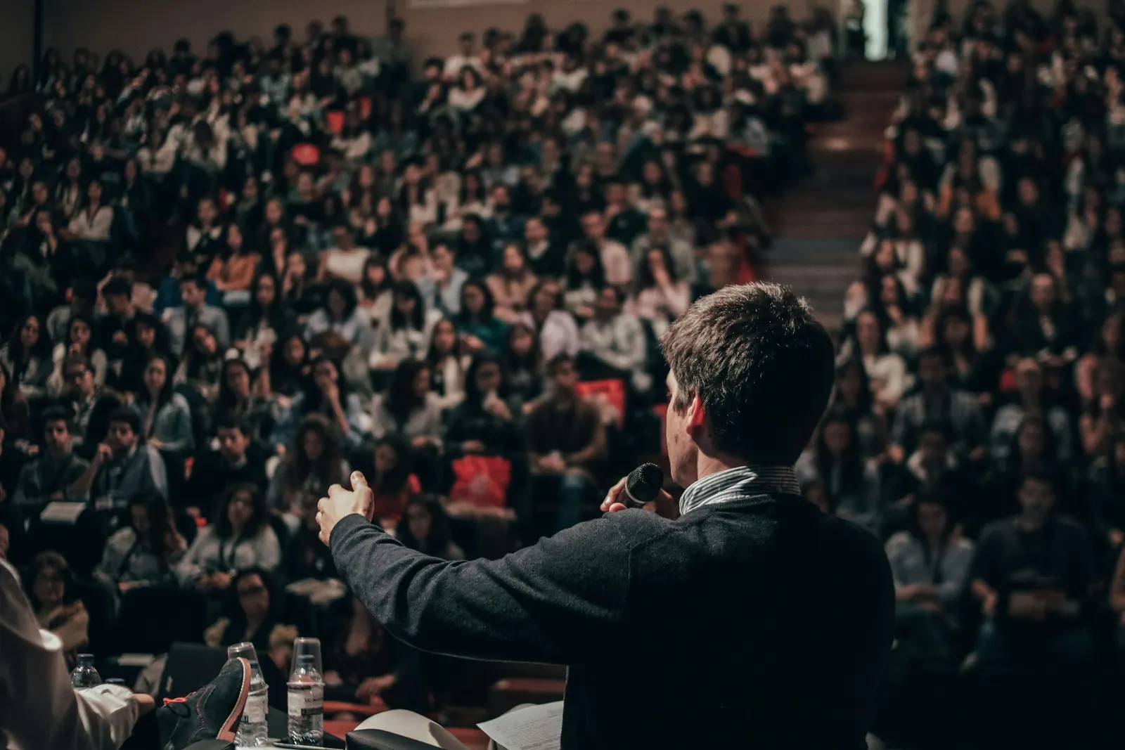 A speaker presenting to an audience