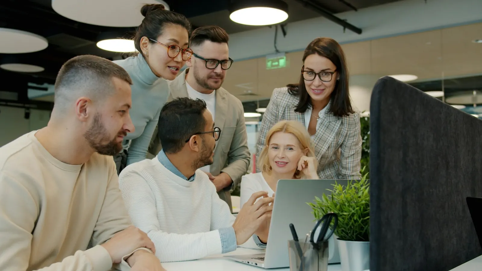 A team reviewing work together at a table